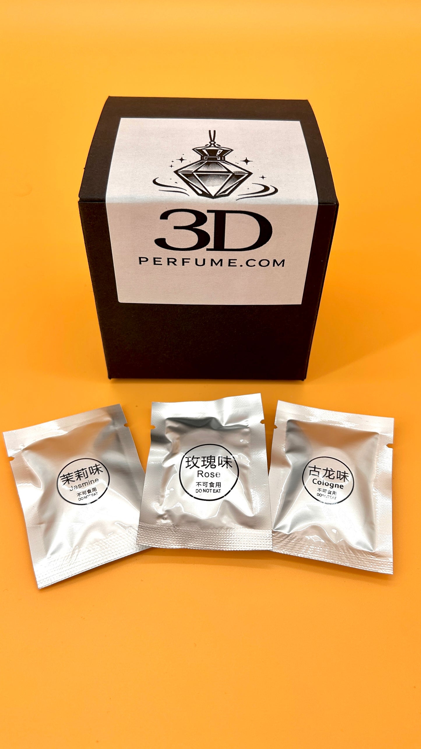 3D Perfume packaging with three sample packets on an orange background