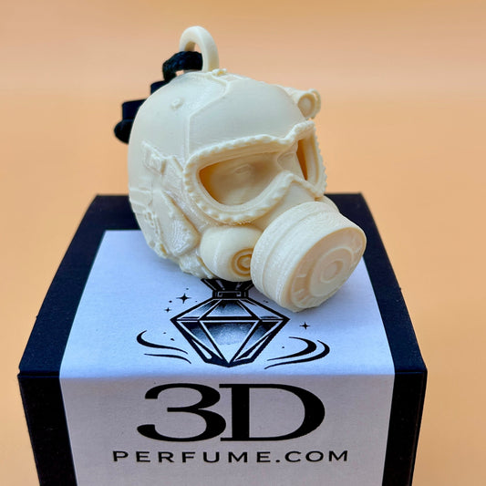 3D-printed gas mask on a box with '3D Perfume.com' branding.