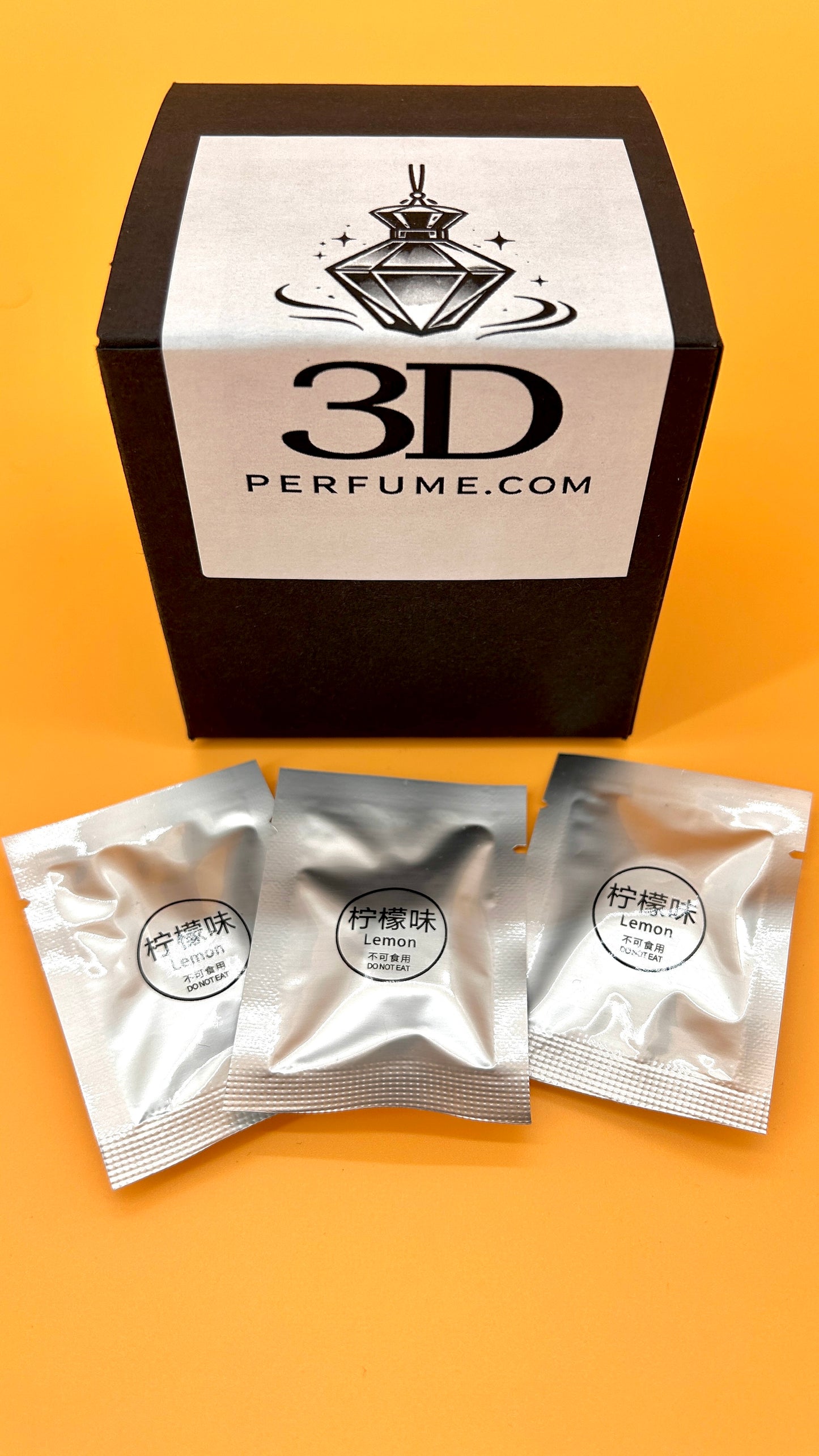 3D Perfume packaging with three sample packets on an orange background