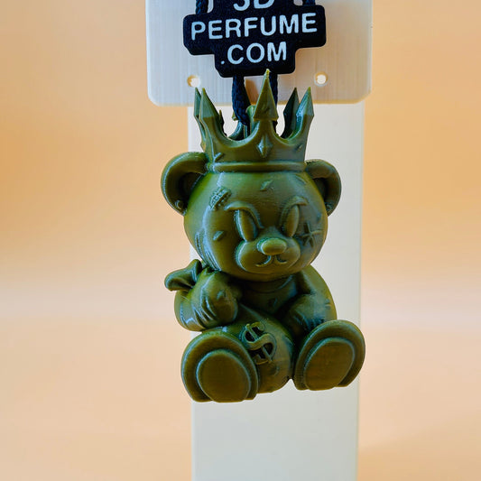 Green perfume bottle shaped like a bear with a crown on a stand, branded '3D Perfume'.
