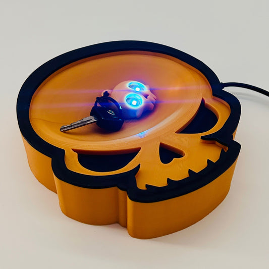 3D printed skull keychain bowl with a skull keychain and LED blue eyes. 